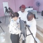 • Satmit Kaur (L) showing the health workers how to use the ultra portable x-ray machines