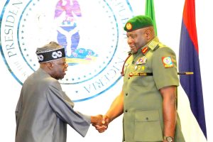 L-R: President Bola Ahmed Tinubu, Decorating the Newly appointed Chief of Defence Staff, General Olufemi Olatubosun Oluyede, at the Presidential Villa Abuja