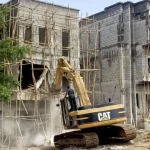 FCTA demolishes 11 illegal duplexes built near high-tension lines and stream