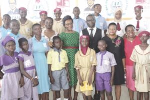 Bilewu, Esiri, Taofeek and Onuorah with schoool children at the event