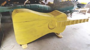 Coffin made in the shape of guitar
