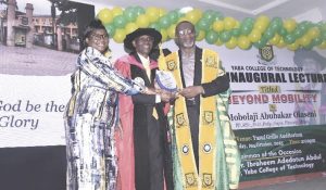 Dr. Abdul presenting plaque of discharged to Dr. Olaseni with his wife, Pastor Olaseni