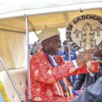 Eze Eberechi Oji of Arochukwu Kingdom acknowledging cheers during the Ikeji Aro Festival procession