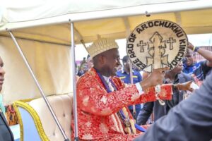 Eze Eberechi Oji of Arochukwu Kingdom acknowledging cheers during the Ikeji Aro Festival procession