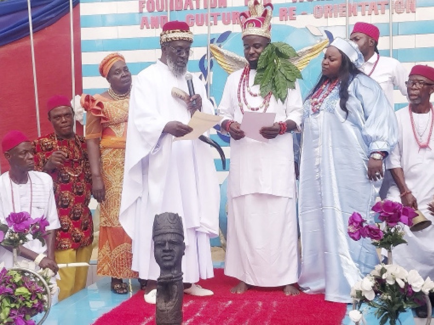 Ezeoba Ramas Okoye Asuzu presenting certificate of recognition to Chief Prosper Chukuka during the ceremony