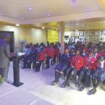Manuaka (backing) addressing the senior
