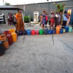 Nigerians buying cooking gas