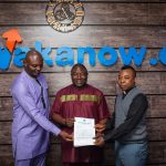 Group Chief Executive Officer of Wakanow.com, Bayo ‘Lion’ Adedeji flanked by Fr. Cyriacus Emedolu, Madonna University Administrator (right) and Mr. Chima Achu, alumnus of Madonna University, during the official presentation of the letter nominating him for the conferment of an Honorary Doctor of Business Administration by the institution.