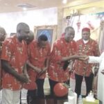 Umahi presenting vehicle keys to AYF leaders