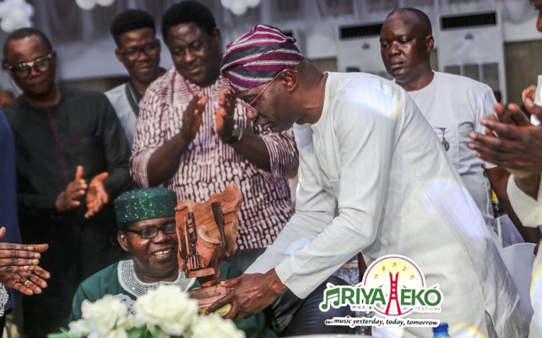 •Governor Sanwo-Olu presenting award to Evangelist Ebenezer Obey
