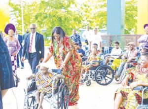 •Mrs Nwifuru distributes wheelchairs