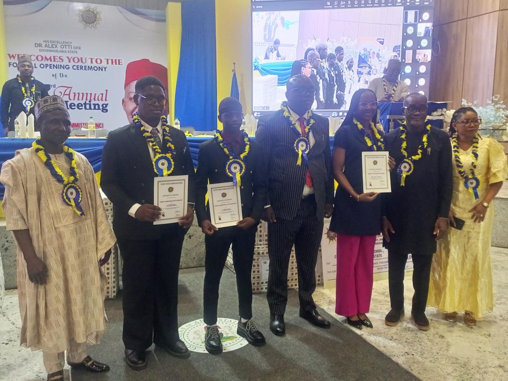 WAEC Head of National Office, Dr. Amos Dangut (left), Abia Education Commissioner,  Goodluck Ubochi and WASSCE awardees at NNC event