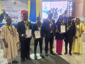 WAEC Head of National Office, Dr. Amos Dangut (left), Abia Education Commissioner,  Goodluck Ubochi and WASSCE awardees at NNC event