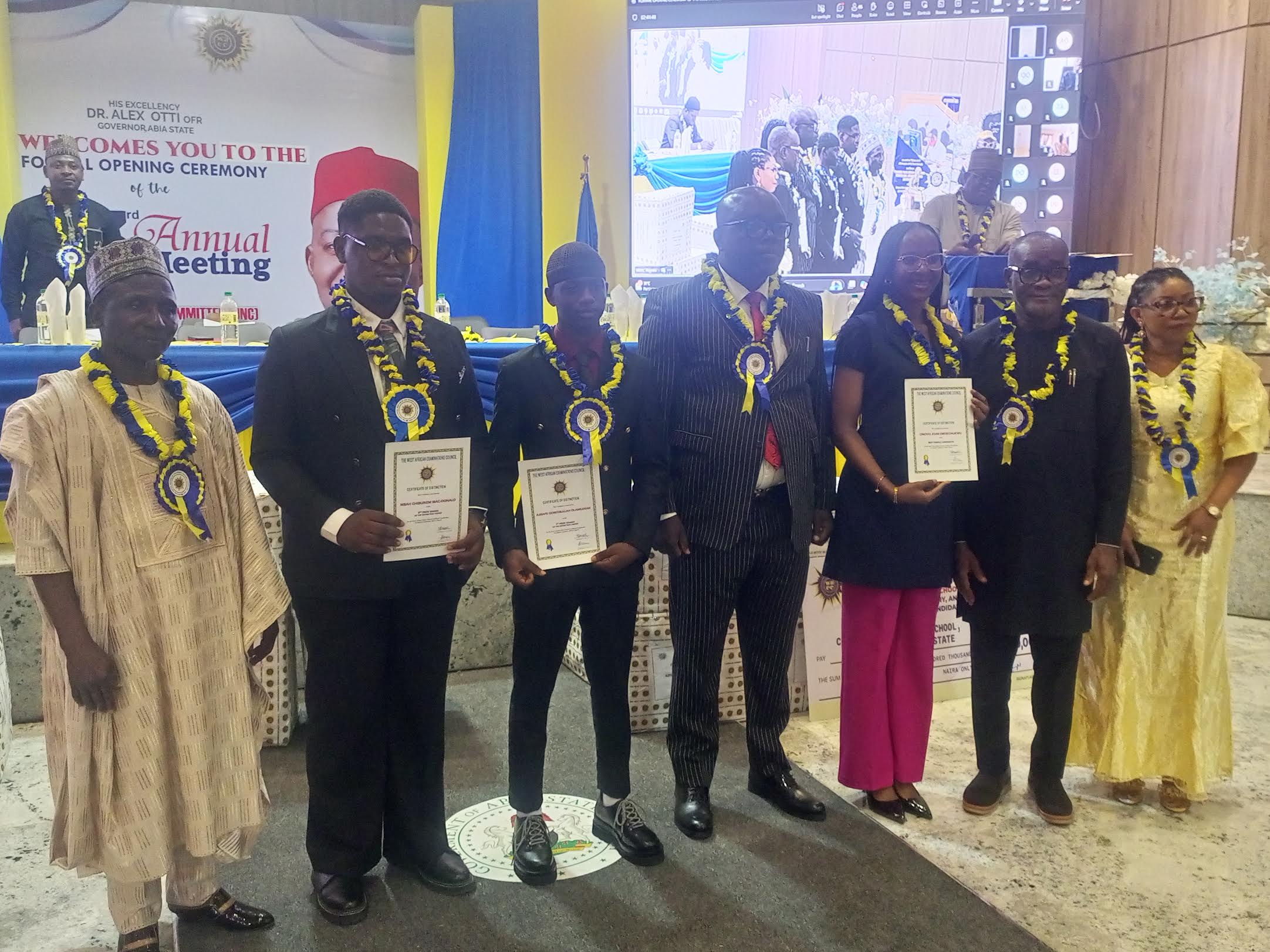 WAEC Head of National Office, Dr. Amos Dangut (left), Abia Education Commissioner,  Goodluck Ubochi and WASSCE awardees at NNC event