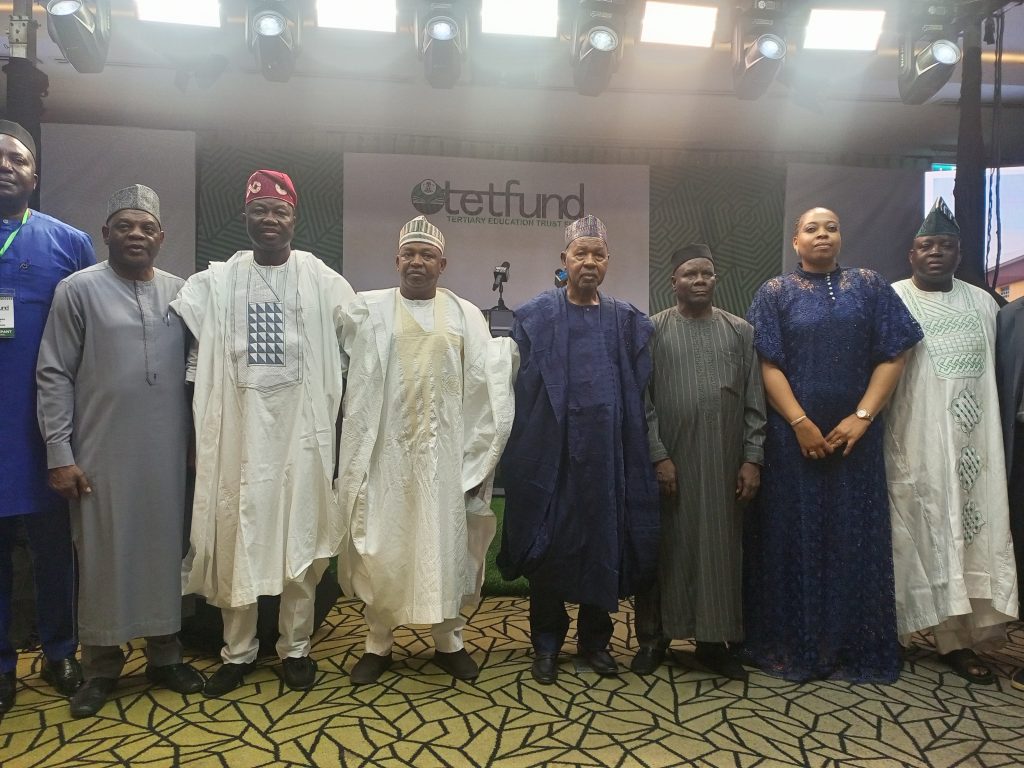 Aminu Masari (4th right), Echono (left) and TETFund Board of Trustees members at the Town Hall meeting in Lagos