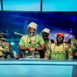 A group of soldiers led by Lieutenant Colonel Pascal Tigri appear on state television, declaring that Benin’s President Patrice Talon has been “removed from office”. On December 7, 2025. © Screengrab BTV