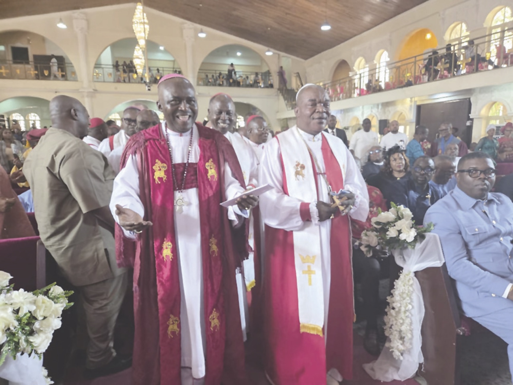 Aba (r), with Sunday Onuoha, dancing during the thanksgiving procession at the Methodist Cathedral of Unity, Wuse Zone 3, Abuja.