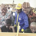Alausa, Dangut and Ismaila Adiatu, Senior Special Assistant to the minister observing as candidates respond to CB- exam questions