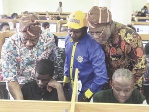 Alausa, Dangut and Ismaila Adiatu, Senior Special Assistant to the minister observing as candidates respond to CB- exam questions