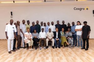 Chairman:Chief Executive Officer, Cosgrove Investment Limited, Mr. Umar Abdullahi OFR (seated in the middle) flanked on both sides and around by management staff of the organisation.