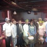 Dr. Bakare (middle cutting the cake) flanked by other dignitaries at the event