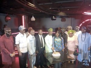 Dr. Bakare (middle cutting the cake) flanked by other dignitaries at the event