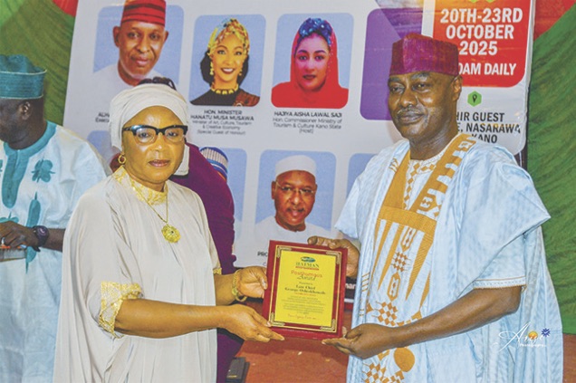 George Oshiokhamele Junior receiving the post – humous award on behalf of his late father