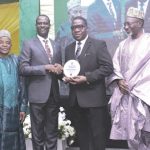 Oyedele (2nd left) presenting plaque to Bamidele flanked by Afolabi (left) and Abdul at the lecture.