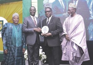 Oyedele (2nd left) presenting plaque to Bamidele flanked by Afolabi (left) and Abdul at the lecture.
