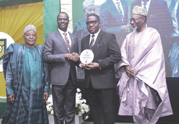 Oyedele (2nd left) presenting plaque to Bamidele flanked by Afolabi (left) and Abdul at the lecture.