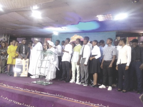 Scholarship beneficiaries with Bishop Samson and wife