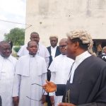 Senor lawyers and clerics after the court session