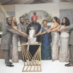 The celebrant, Sir Emeka Ukwuaba (middle), flanked by family members, cutting the birthday cake
