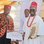 Chairman of Idemili North and South Traditional Rulers Forum, Igwe Charles Agbala handing over Certificate of Recognition to Chief Hamilton Emeka Ezeonu after his recognition as Ikemba Idemili yesterday in Abatete, Anambra State