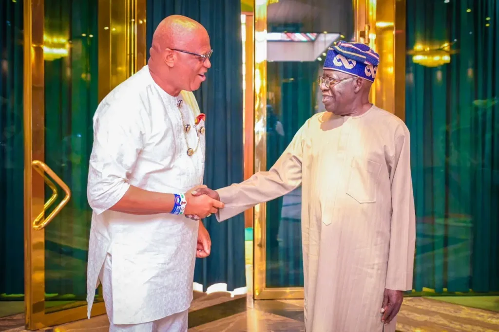 Akwa Ibom Governor Umo Eno and President Bola Tinubu shake hands