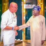 Akwa Ibom Governor Umo Eno and President Bola Tinubu shake hands