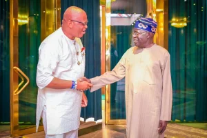 Akwa Ibom Governor Umo Eno and President Bola Tinubu shake hands
