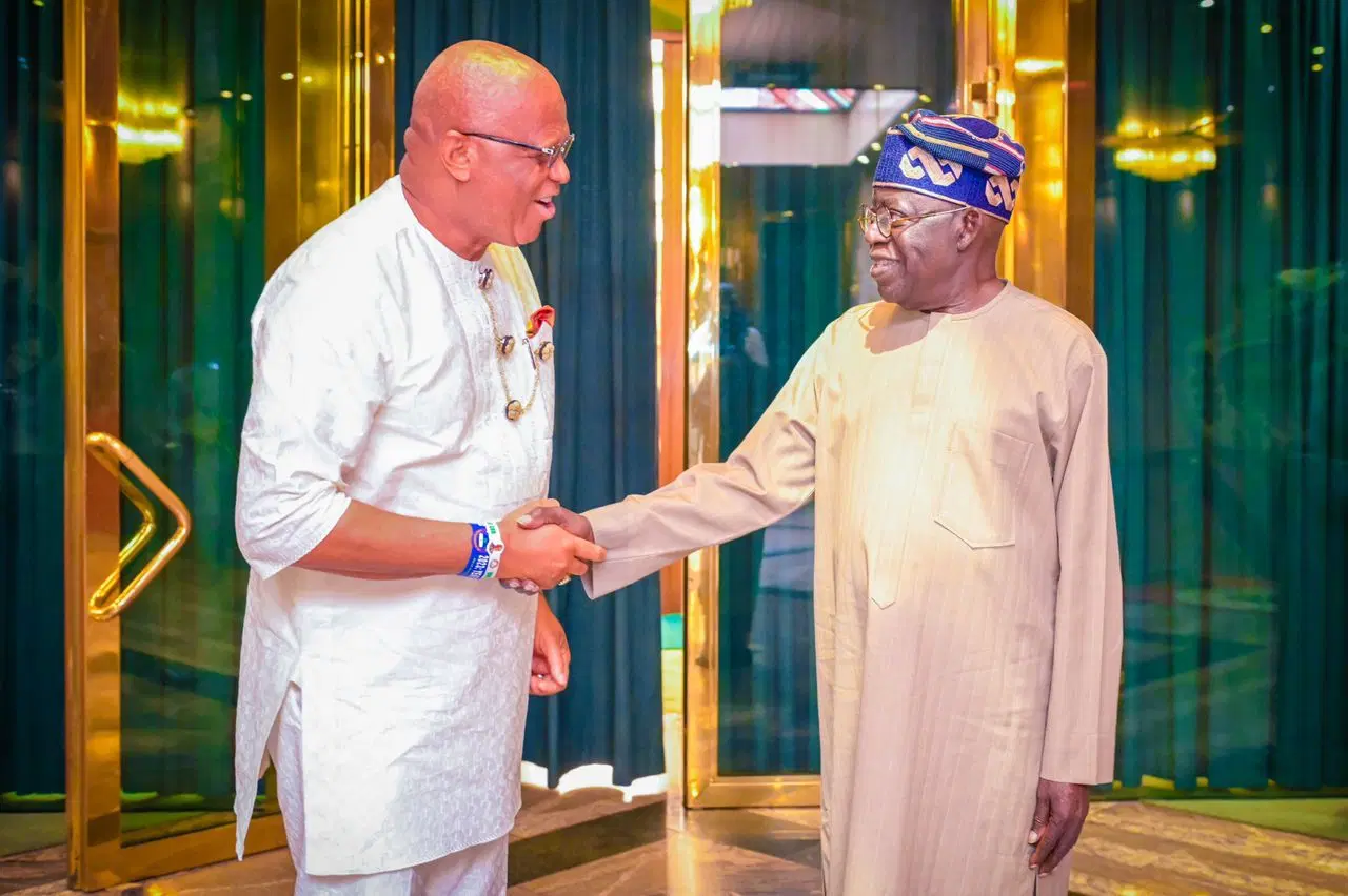 Akwa Ibom Governor Umo Eno and President Bola Tinubu shake hands