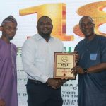 The Sales and Marketing Manager, Iron Products Industries (IPI) Ltd, Musa Umar, (middle) receiving  the Truck Assembler) Body Builder of the Year from NAJA members