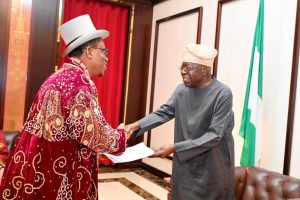 Olalebhu Abureni, HRM Collins Daniel (left) presenting a report to the President Bola Tinubu during the President’s audience with the Ogbia Brotherhood delegation at the Presidential Villa Abuja on Wednesday. Photo State House