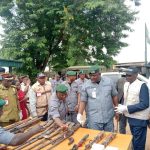 The Customs Area Controller of Ogun 1 Area Command of the Nigeria Customs Service, Oladapo Afeni, handing over arms and.ammunition intercepted by the command to the Director-General of the National Centre for the Control of Small Arms and Light Weapons, Abiodun Alamutu