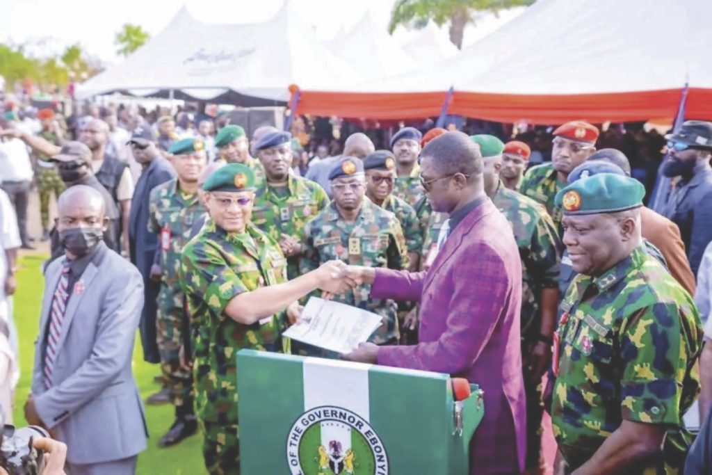Nwifuru handing over the land document to the military