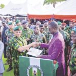 Nwifuru handing over the land document to the military