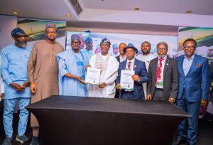 Benue State Governor Rev Fr Hyacinth Alia, the MD REA, Mr Abba Aliyu an other government officials after the MOU was signed