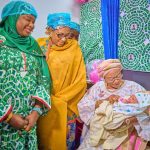 L-R Minister of State for the FCT Mariya Mahmoud, Wife of the Vice President, Hajia Nana Shettima and the First Lady of Nigeria Oluremi Tinubu holding the baby of the year, Baby Adakole born at Federal Medical Centre, Jabi at 12 midnight on Thursday 1st January, 2026