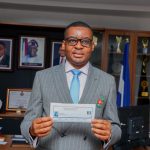 Rt. Hon. Peter Odey, PhD with his APC membership card