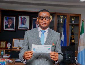 Rt. Hon. Peter Odey, PhD with his APC membership card