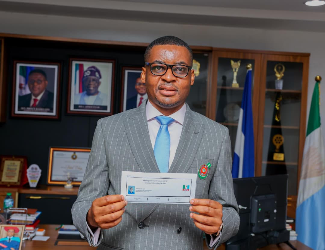 Rt. Hon. Peter Odey, PhD with his APC membership card