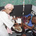 L-R: Nigeria's First Lady, Oluremi Tinubu, presenting National Population Commission birth certificate and gifts, to Mr and Mrs Celestine Adakola Aeheme during the Visit to First Baby of the Year 2026, at the Federal Medical Centre Jabi,Abuja on Thursday, January 1, 2026