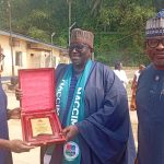 Thompson Eja, CEO of Sea Express presenting an award to the national president of NACCIMA, Jani Ibrahim while Kelly Ayamba , President of CALCCIMA looks on